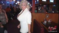 Big tit prostitute Claudia-Marie at a nightclub in a tight fuzzy sweater